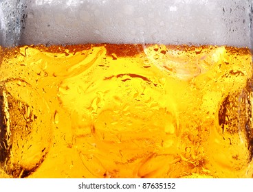 Cold Beer With Suds In Glass