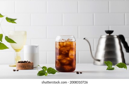 Cold black coffee with ice cubes on a white background. Coldbrew. Summer drinks.