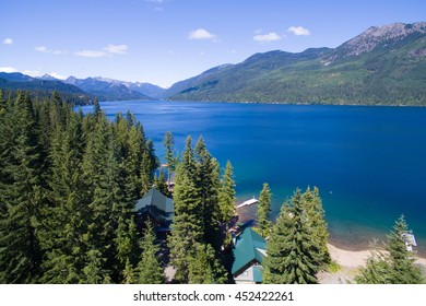 Cold Blue Mountain Lake In State Washington, Lake Cle Elum In The Middle Of The Summer With Waterfront Properties, Mountains And Green Fir Trees. Aerial Photo.