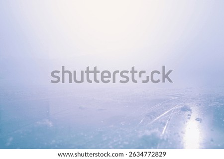 COLD BLUE WINTER BACKGROUND, ICE AND SNOW DESIGN WITH LIGHT HAZE AND EMPTY SPACE FOR WINTER AND CHRISTMAS MONTAGE