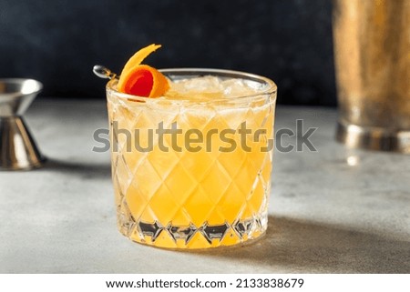 Cold Boozy Rye Whiskey Sour with Lemon and a Garnish