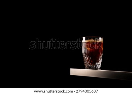 Cold Brew Coffee with Ice Cubes on Black Background