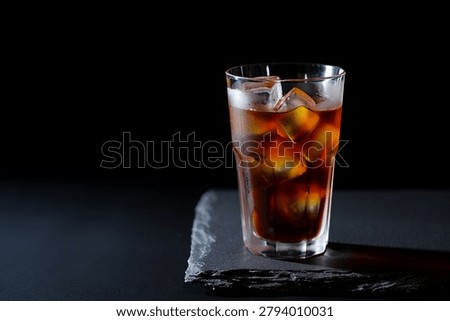 Cold Brew Coffee with Ice Cubes on Black Background