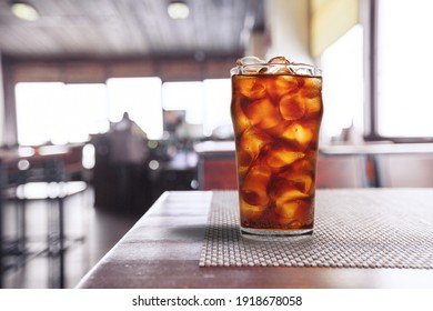 Cold Brew Iced Coffee In A Clear Glass Cup On A Desk