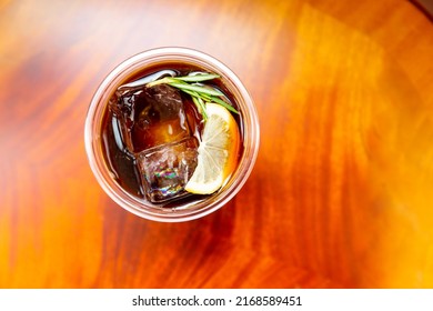 Cold Brewed Iced Latte Coffee, Showing Separate In A Layer The Bottom As Milk Top By Coffee Shot In A Plastic Glass