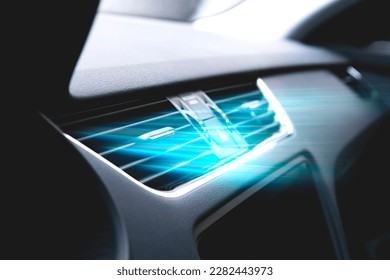 Cold from the car air conditioner. Air vents with streams of blue air flow. Air purification and filtration. Clean fresh smell. Vehicle odor removal.