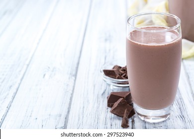 Cold Chocolate Milk Drink (close-up Shot) On Wooden Background