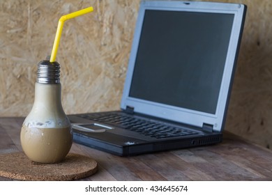 Cold coffee in cup on notebook background,