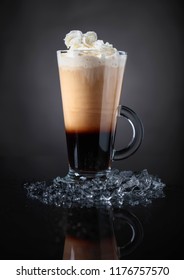 Cold Coffee Drink Or Cocktail With Cream On A Black Background. 