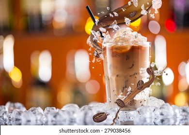 Cold Coffee Drink With Ice, Beans And Splash, Close-up.