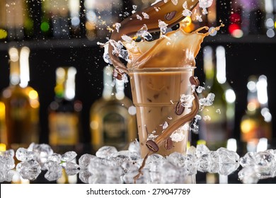 Cold Coffee Drink With Ice, Beans And Splash, Close-up.