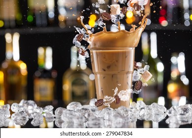 Cold Coffee Drink With Ice, Beans And Splash, Close-up.