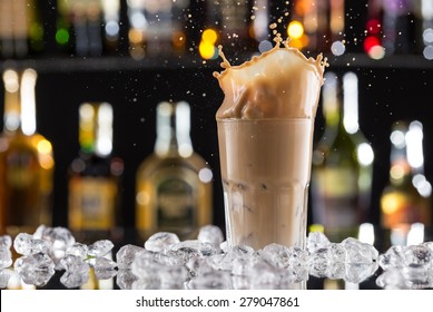 Cold Coffee Drink With Ice, Beans And Splash, Close-up.