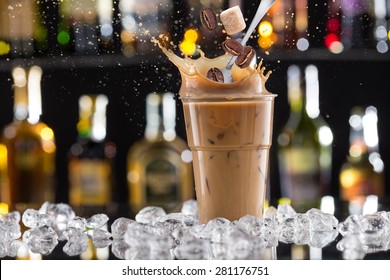 Cold Coffee Drink With Ice, Beans And Splash, Close-up.