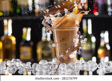 Cold Coffee Drink With Ice, Beans And Splash, Close-up.