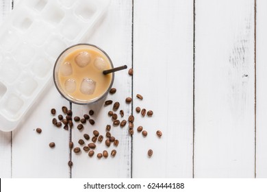 Cold Coffee Glass With Ice Cubes On White Table Background Top View Mockup