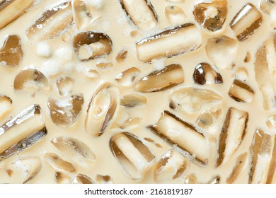 Cold Coffee And Ice Cubes,Coffee Texture And Macro Ice Cubes,Close-up Of Cold Latte Drink With Ice Cubes,