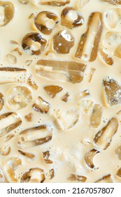 Cold Coffee And Ice Cubes,Coffee Texture And Macro Ice Cubes,Close-up Of Cold Latte Drink With Ice Cubes