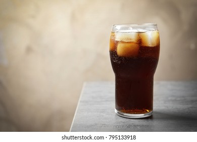 Cold cola in glass on table - Shutterstock ID 795133918