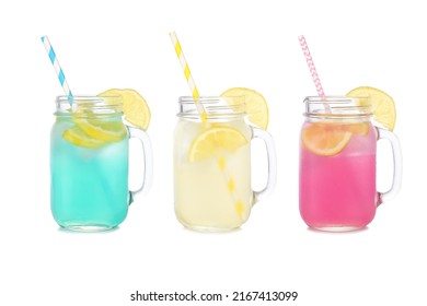 Cold, colorful summer lemonade drinks. Blue, yellow and pink colors in mason jar glasses isolated on a white background.