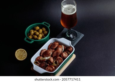 Cold Craft Beer With German Sausage,olives And Lime