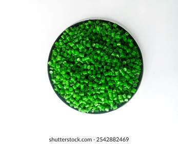 cold cutting type masterbatch granules green color in pantri cup, pigment coloring resin raw material plastic, isolated on white background for product catalog design profile of industrial plastic