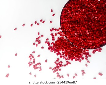 cold cutting type masterbatch granules red color in pantri cup, pigment coloring resin raw material plastic, isolated on white background for product catalog design profile of industrial plastic