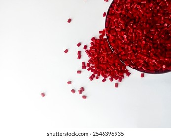 cold cutting type masterbatch granules red color in pantri cup, pigment coloring resin raw material plastic, isolated on white background for product catalog design profile of industrial plastic