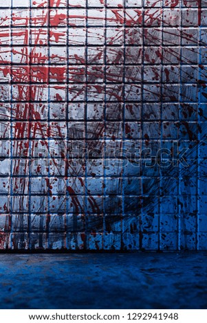 Cold and dark background from the scene of the murder. Dirty marble tile blurred by splashes of red blood.