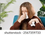 Cold And Flu. Portrait Of Ill Woman Caught Cold, Feeling Sick And Sneezing In Paper Wipe. Closeup Of Beautiful Unhealthy Girl Covered In Blanket Wiping Nose. Healthcare Concept.