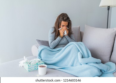 Cold And Flu. Portrait Of Ill Woman Caught Cold, Feeling Sick And Sneezing In Paper Wipe. Closeup Of Beautiful Unhealthy Girl Covered In Blanket Wiping Nose. Healthcare Concept. High Resolution - Shutterstock ID 1214603146
