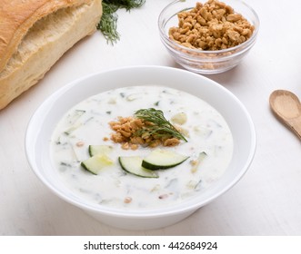 Cold Fresh Tarator Soup With Cucumber And Nuts In White Bowl