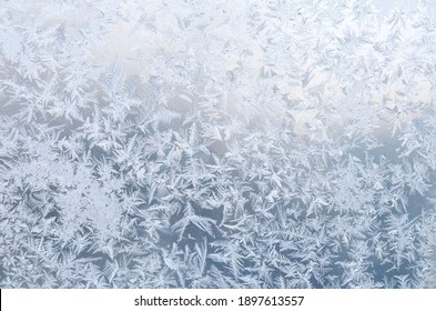 Cold Frost Patterns On Window Glass. Winter Texture