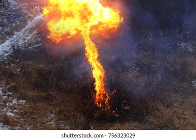 Cold Frosty Evening On The River Bank. Lost Hikers Kindles A Rescue Fire Using Gasoline. Campfire. Kindle Fire. Rescue Fire. 