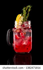 Cold Fruit Lemonade In Mason Jar Isolated On Black