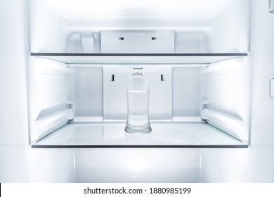 Cold Glass Of Water In Clean Refridgerator