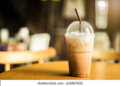 Cold Iced Coffee On Wooden Table, Background.