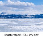 Cold icy winter landscape of frozen Lake Laberge, Yukon Territory, Canada