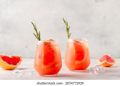 Cold lemonade cocktail of fresh grapefruit juice, alcohol and ice cubes. - Powered by Shutterstock