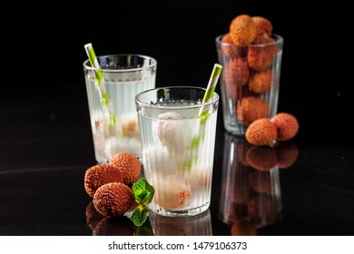 Cold Lychee  Cocktail. The Summer Tropical Refreshing Litchi Drink On A Black Background