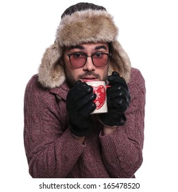 cold man drinking to get warm