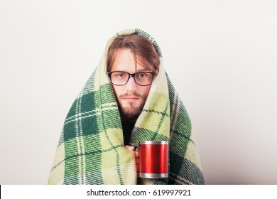 Cold Man With Flu Wrapped In A Warm Blanket, Holding A Mug