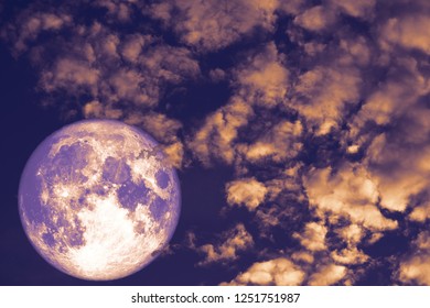 Cold moon back over heap cloud red night sky, Elements of this image furnished by NASA