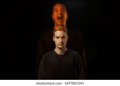 Cold outside, crazy inside. The versatility of man - opened emotions and hidden feelings. Caucasian man on black background with different faces of condition. Double exposure. Mental health.