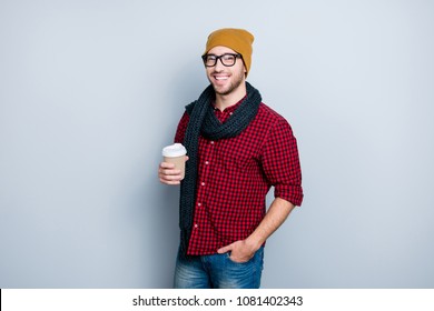 It's cold outside! Trendy fashionable handsome attractive stylish masculine virile guy dressed in casual outfit and glasses enjoying fresh aromatic tea, isolated on gray background - Powered by Shutterstock