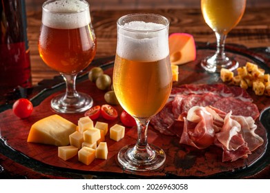 Cold Platter With Draft Beer On A Wooden Cutting Board