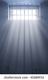 A Cold Prison Cell With Sunshine Through Window