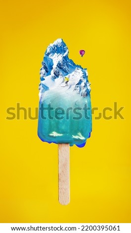 Cold refreshing ice cream with half alpine snow mountain summit and air balloon - hot summer concept
