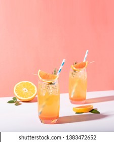 Cold And Refreshing Orange Punch Cocktail With Orange Slice On Color Background. Summer Drink.
