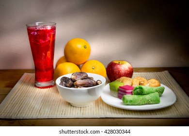 Cold Refreshing Syrup Drinks, Sweet Dates, Kuih Are Simple And Common Iftar Break Fast Food During Fasting Month Of Ramadan. Fine Art Rendition.